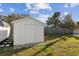 Backyard shed with a door and a garden with stone pavers at 3632 E Kaley Ave, Orlando, FL 32812