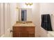 Bathroom with a granite countertop, wood vanity, and a neutral color scheme at 4004 Barwood Dr # 3804, Orlando, FL 32839