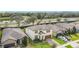 Aerial view of a home featuring well-maintained landscaping, two-car garage, and brown trim at 5311 Brydon Woods Cir, St Cloud, FL 34771