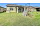 Enjoy outdoor living in this backyard featuring a screened lanai and playset at 5311 Brydon Woods Cir, St Cloud, FL 34771