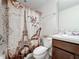 Cozy bathroom featuring a Paris-themed shower curtain and a white sink vanity at 5311 Brydon Woods Cir, St Cloud, FL 34771