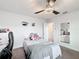 Bedroom with a desk, and ceiling fan with lashes art at 5311 Brydon Woods Cir, St Cloud, FL 34771