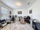 Bright office featuring neutral walls, dual work spaces, and a patterned rug that adds warmth to the room at 5311 Brydon Woods Cir, St Cloud, FL 34771