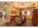 Formal dining room with coffered ceilings and ample space for entertaining at 5719 Emerson Pointe Way, Orlando, FL 32819