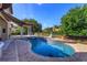 Beautiful pool with a fountain and spa, surrounded by lush greenery offering a serene and private retreat at 5719 Emerson Pointe Way, Orlando, FL 32819