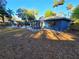 The backyard showcases a pool, lawn, and blue exterior walls at 621 Daron Ct, Winter Springs, FL 32708