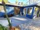 The backyard features a deck and the home's blue painted exterior walls at 621 Daron Ct, Winter Springs, FL 32708