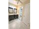 Bathroom featuring double vanities with granite counters, tile flooring, and a tiled tub/shower combination at 621 Daron Ct, Winter Springs, FL 32708