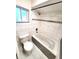 Bathroom featuring a tiled tub/shower, tiled floors and a large window at 621 Daron Ct, Winter Springs, FL 32708