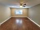 Spacious room featuring neutral walls, ceiling fan, window and hard surface flooring at 621 Daron Ct, Winter Springs, FL 32708