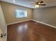 Bedroom with ceiling fan, window, and hard surface floors at 621 Daron Ct, Winter Springs, FL 32708