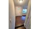 Light and bright foyer with wood-look flooring, a white front door, and an adjacent living space at 621 Daron Ct, Winter Springs, FL 32708