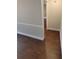 Neutral hallway featuring decorative trim and hard surface flooring at 621 Daron Ct, Winter Springs, FL 32708