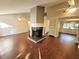 Inviting living room with wood floors, ceiling fan and fireplace at 621 Daron Ct, Winter Springs, FL 32708