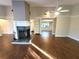 Bright and airy living room featuring wood floors, a fireplace, and lots of natural light at 621 Daron Ct, Winter Springs, FL 32708