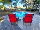 The pool and chairs provide an outdoor oasis at 621 Daron Ct, Winter Springs, FL 32708