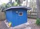 Image of shed painted blue with an accent light at 621 Daron Ct, Winter Springs, FL 32708