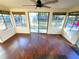 A sun room with a ceiling fan and large windows providing outdoor views at 621 Daron Ct, Winter Springs, FL 32708