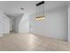 Bright dining area featuring tile flooring and a modern chandelier at 701 Fortanini Cir, Ocoee, FL 34761