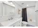 Bathroom featuring white subway tile in the shower, patterned floor tile, and white vanity at 704 Baywood Dr, Sanford, FL 32773