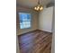 Inviting dining room with ample natural light and a classic chandelier at 7314 Seena Ct, Orlando, FL 32835