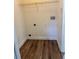 Laundry room area with washer and dryer hookups and updated flooring at 7314 Seena Ct, Orlando, FL 32835