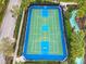 Aerial view of the community's well-maintained blue and green outdoor basketball court ready for a friendly game at 8941 Rhodes St, Kissimmee, FL 34747