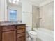 Bathroom showcasing a large mirror, vanity, and bathtub at 8941 Rhodes St, Kissimmee, FL 34747