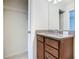 Bathroom view featuring a granite vanity and closet at 8941 Rhodes St, Kissimmee, FL 34747