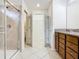 Bright bathroom showcasing tiled shower, walk-in closet, and vanity at 8941 Rhodes St, Kissimmee, FL 34747