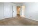 Spacious carpeted bedroom features neutral colors and a closet at 8941 Rhodes St, Kissimmee, FL 34747