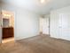 Carpeted bedroom featuring a connecting bathroom at 8941 Rhodes St, Kissimmee, FL 34747