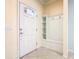 Entrance way features a door and coat rack with storage at 8941 Rhodes St, Kissimmee, FL 34747