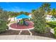 A charming playground area with a blue awning, play structures, and shade trees provides a fun space for  at 8941 Rhodes St, Kissimmee, FL 34747