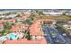 Overhead view featuring the condo community's pool, parking, and landscaping, set against a suburban backdrop at 912 Charo Pkwy # 214, Davenport, FL 33897