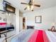 Bedroom with a large mirror closet and a view through the doorway to a small kitchen at 912 Charo Pkwy # 214, Davenport, FL 33897