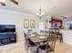 Open floor plan with tile floors and recessed lighting that connects the dining room to the kitchen at 912 Charo Pkwy # 214, Davenport, FL 33897