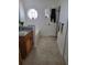 Bright bathroom with granite countertop and travertine tile at 930 Lake Doe Blvd, Apopka, FL 32703