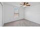 Bedroom featuring neutral walls, plush carpet, a window, and a ceiling fan at 965 Rosinia Ct, Orlando, FL 32828