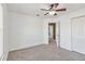 Bedroom featuring plush carpet, neutral walls, and a ceiling fan at 965 Rosinia Ct, Orlando, FL 32828