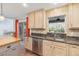 Kitchen featuring tile floors, stainless steel appliances, granite countertops, a stainless steel sink, and view to the backyard at 965 Rosinia Ct, Orlando, FL 32828