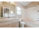 Bathroom featuring a tiled shower/tub, a toilet, and a vanity with a sink and mirror at 1019 Royal Oaks Dr, Apopka, FL 32703