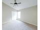 Neutral toned bedroom with carpeted floors, a window and a double door closet at 1019 Royal Oaks Dr, Apopka, FL 32703