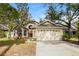 Charming single-Gathering home with a well-maintained lawn and a two-car garage at 1019 Royal Oaks Dr, Apopka, FL 32703