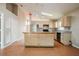 Well-equipped kitchen with an island, stainless steel refrigerator, and tile flooring at 1019 Royal Oaks Dr, Apopka, FL 32703