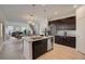 Stylish kitchen featuring a large island and open layout to the living area at 1136 Clay Blvd, Tavares, FL 32778