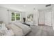 Light and airy bedroom with a large window and a serene view of the outdoors at 1136 Clay Blvd, Tavares, FL 32778