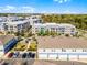 Expansive community aerial view featuring well-maintained buildings, landscaping, and parking areas at 1194 Spotted Sandpiper Loop, Winter Springs, FL 32708