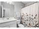 Bathroom with sink, shower, and neutral accents at 1194 Spotted Sandpiper Loop, Winter Springs, FL 32708