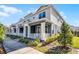 Charming townhome exterior with well-maintained landscaping and inviting front porches at 1194 Spotted Sandpiper Loop, Winter Springs, FL 32708